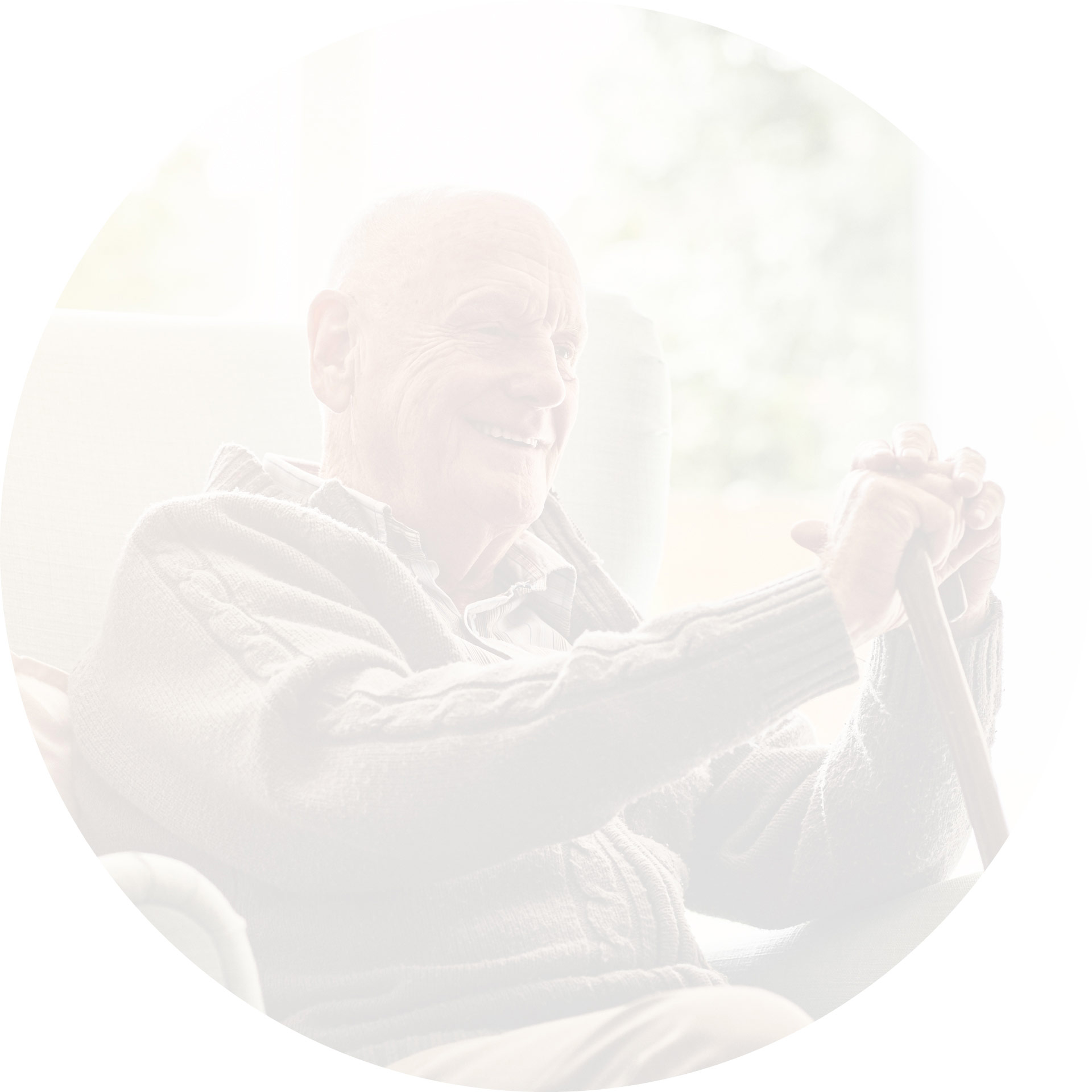 An elderly man happy to have domiciliary care services looking after him