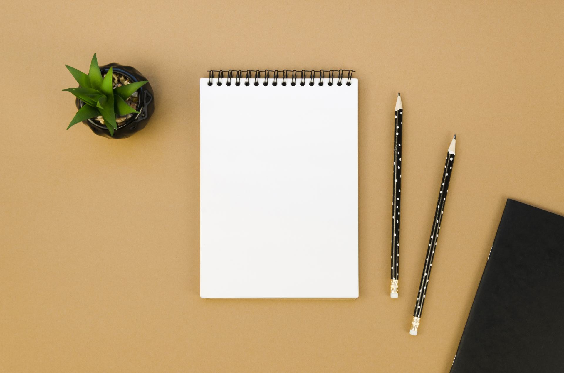 A note pad on a desk. Today, Start Business! is written on the pad in huge letters.