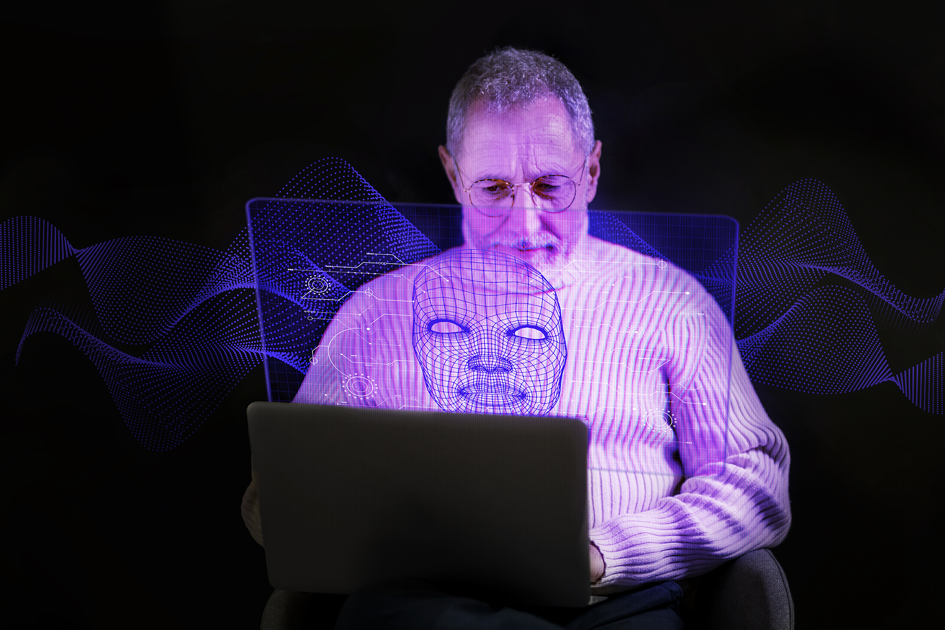 An elderly man using a laptop confidently. Bridging the Digital Divide.