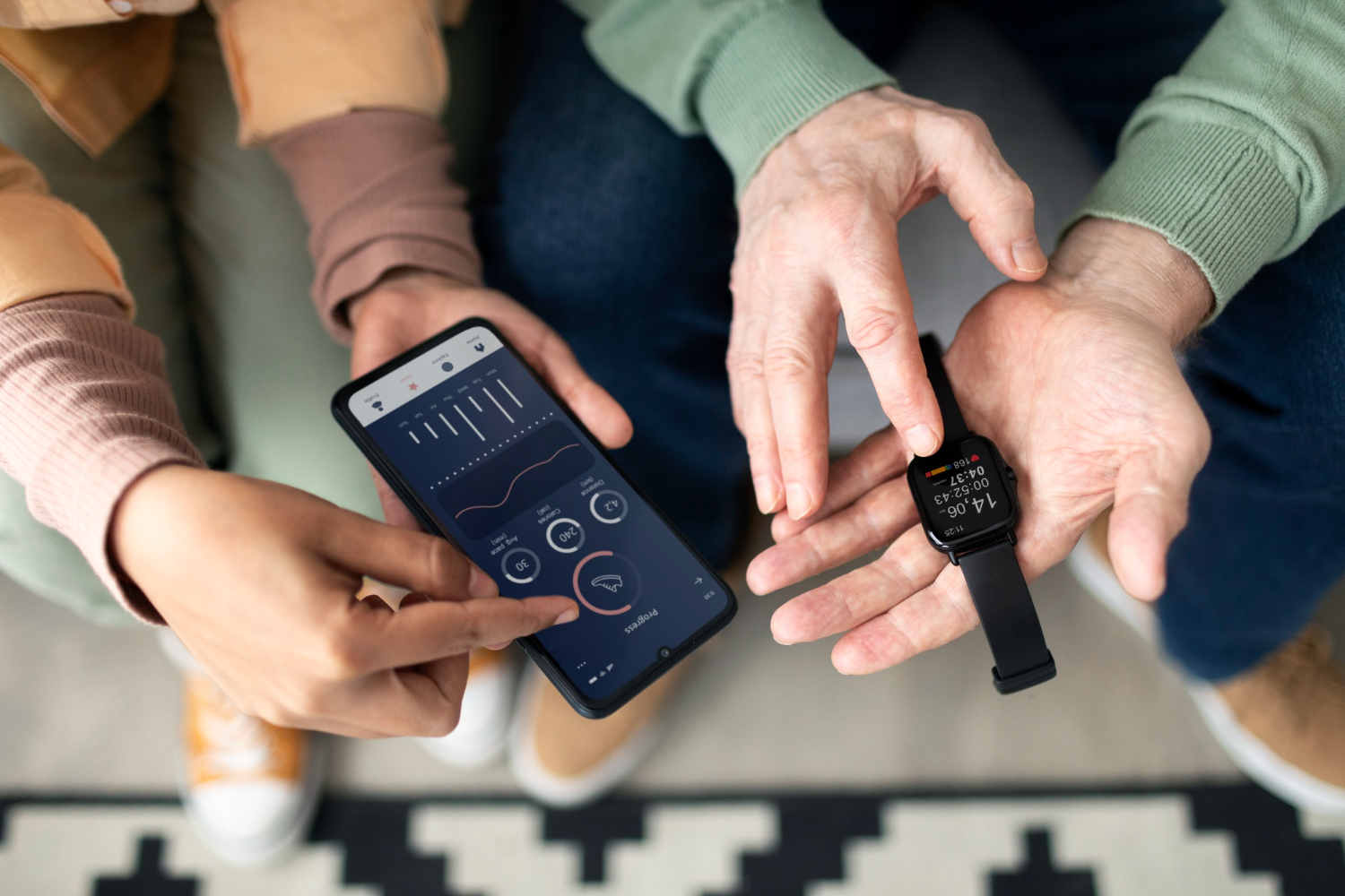 An elderly man being helped with a health and fitness app connected to his smartwatch.
