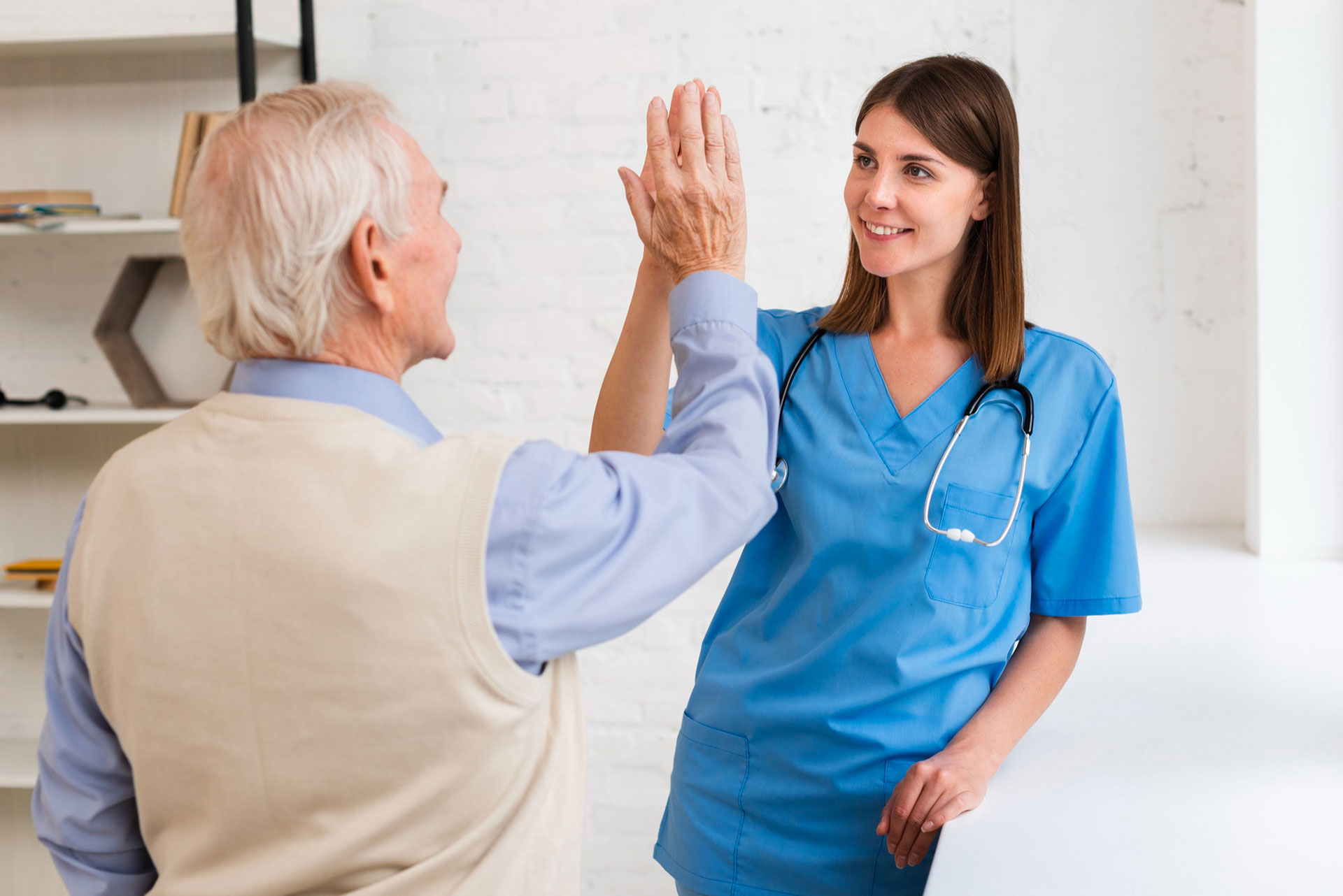 An elderly man and his carer sharing a high five. Become the home care agency that potential clients think of first in 2026. 