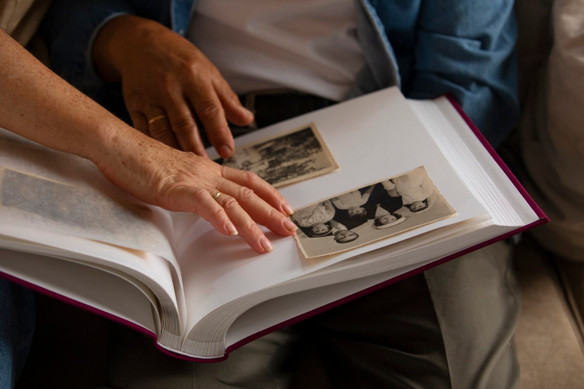 An old gentleman and his carer adding black and white photos to the client’s Life Story Book. An old gentleman and his carer adding black and white photos to the client’s Life Story Book.