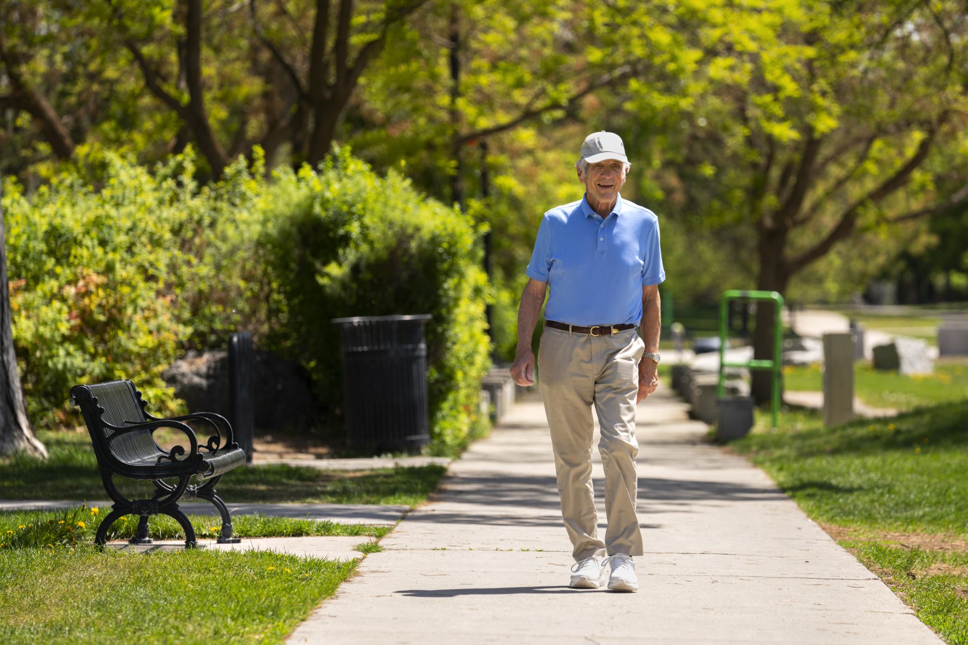An elderly man enjoying a small burst of activity by going for a short walk, part of Age UK's Act Now, Age Better Campaign. 